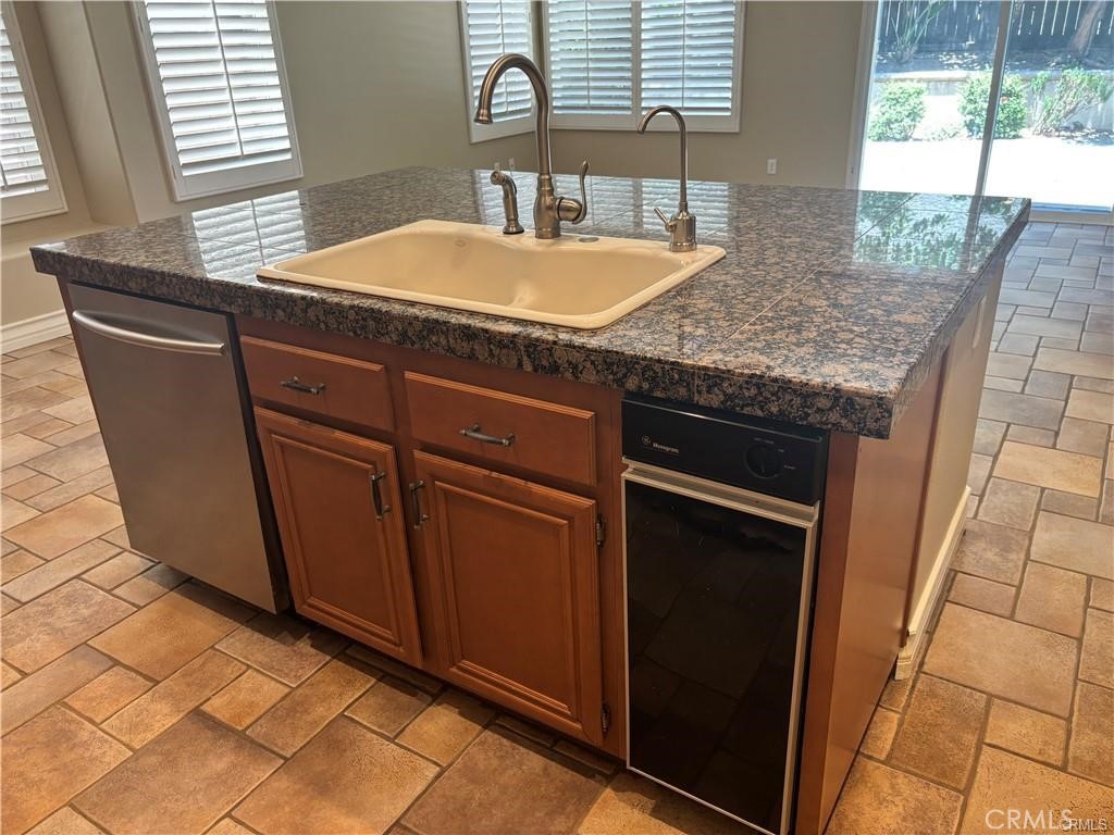 20 Berlamo Rancho Santa Margarita, CA 92688 - Photo 7 of 34 a bathroom with a granite countertop sink and a mirror