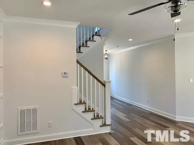 a view of entryway with stairs and wooden floor