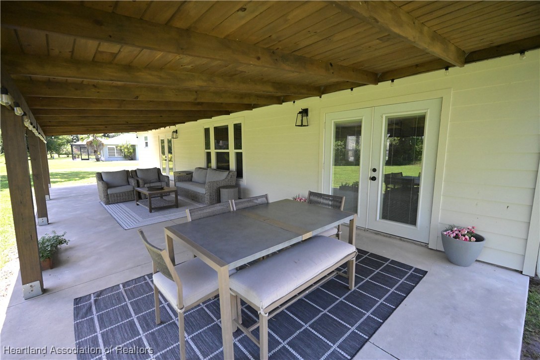 4626 Duffer Loop Sebring, FL 33872 - Photo 31 of 46 Rear Open Porch
