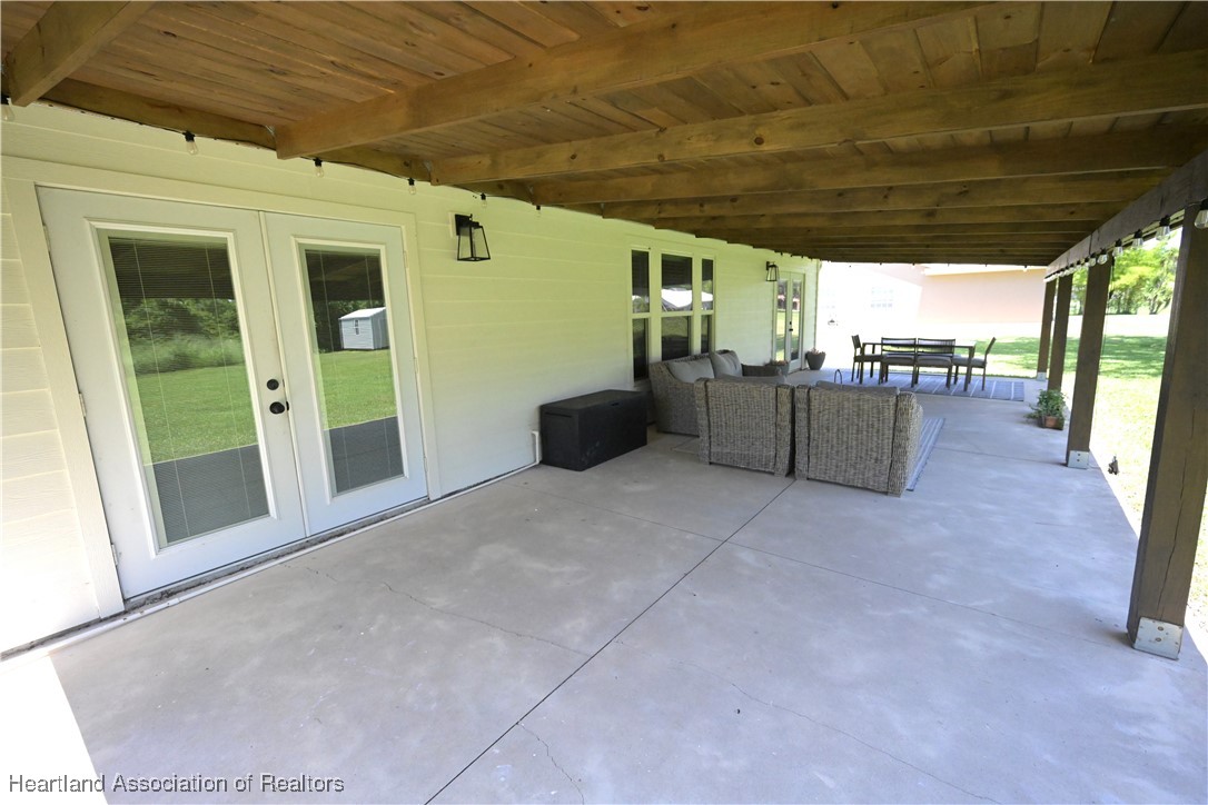 4626 Duffer Loop Sebring, FL 33872 - Photo 32 of 46 Rear Open Porch