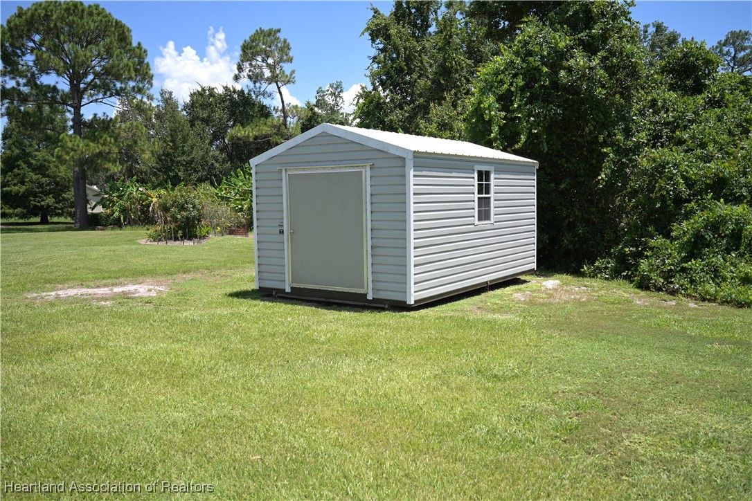 4626 Duffer Loop Sebring, FL 33872 - Photo 34 of 46 Shed