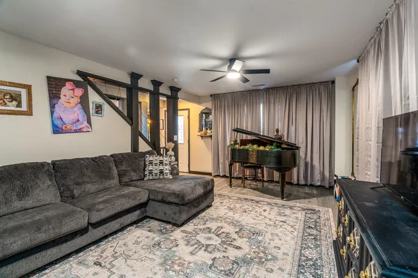 a living room with furniture and a flat screen tv