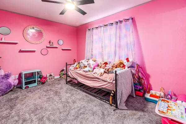 a bed room with a bed and a chair