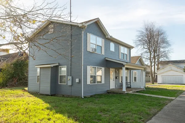 a view of a house with a yard