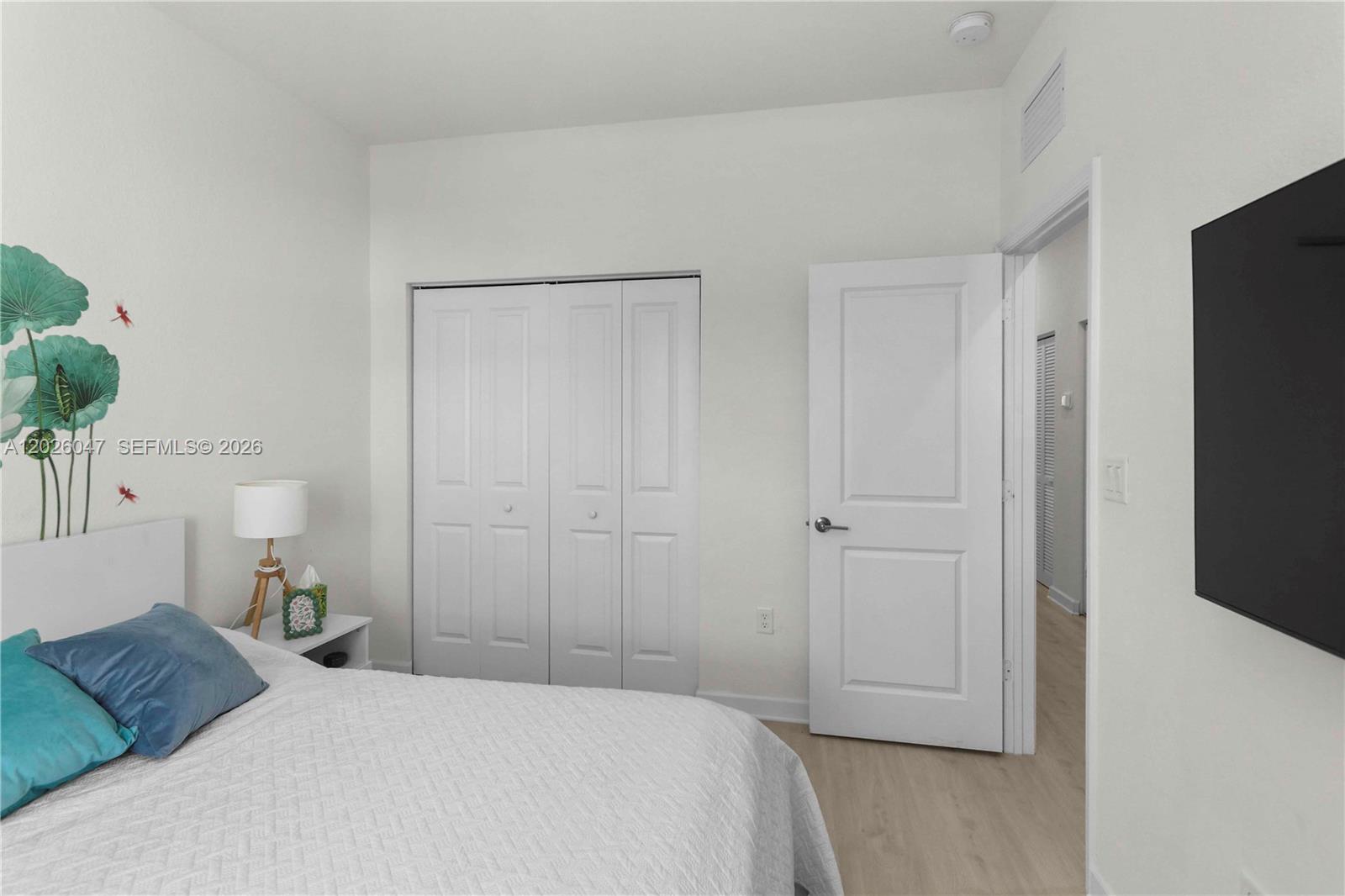 12862 Southwest 231st Street Miami, FL 33170 - Photo 27 of 30 a bedroom with a bed and a potted plant