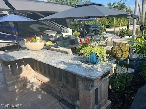 a view of a backyard with sitting area