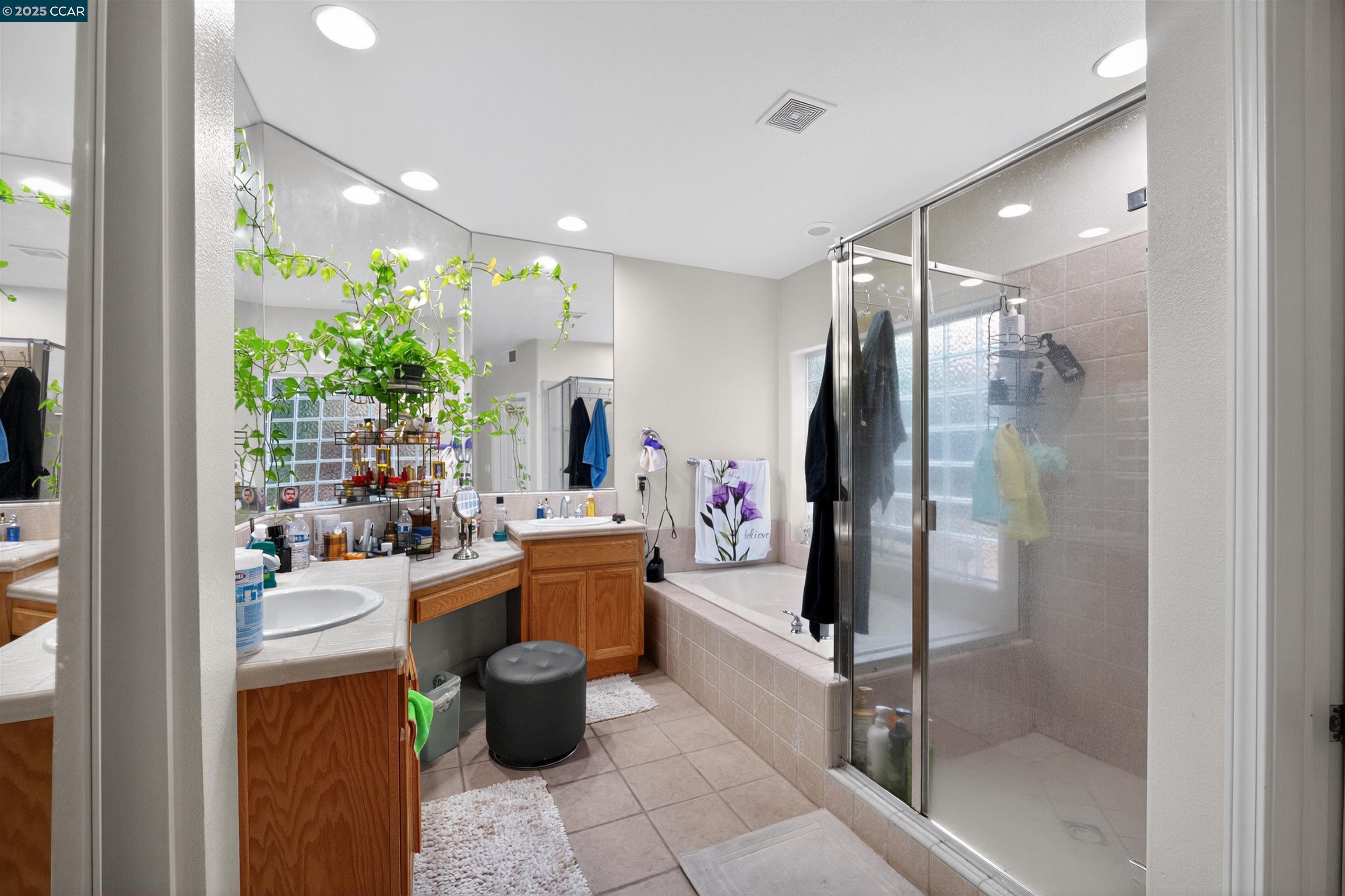 4100 Diorite Court Antioch, CA 94531 - Photo 17 of 35 a room with lots of potted plants and glass doors