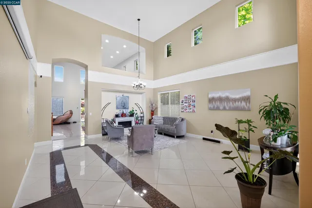 a living room with furniture and couches