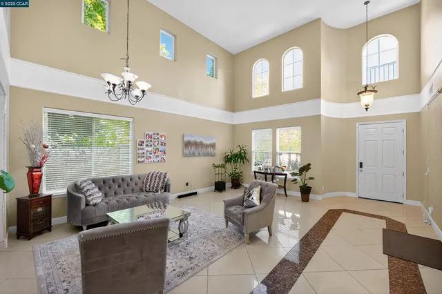 a view of a dining hall with furniture and chandelier