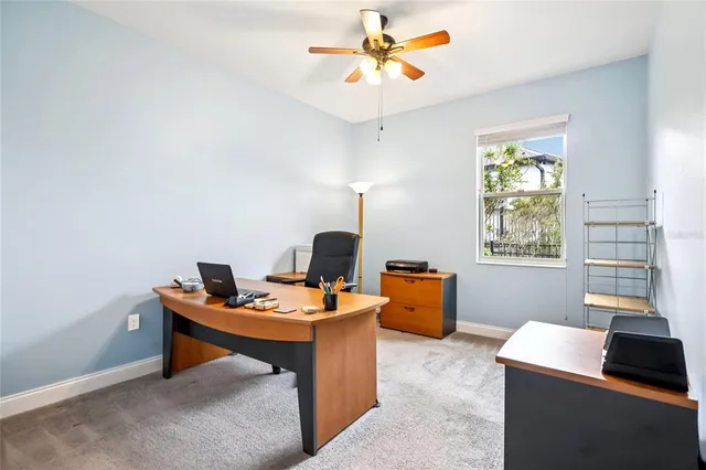 a work room with furniture and a window