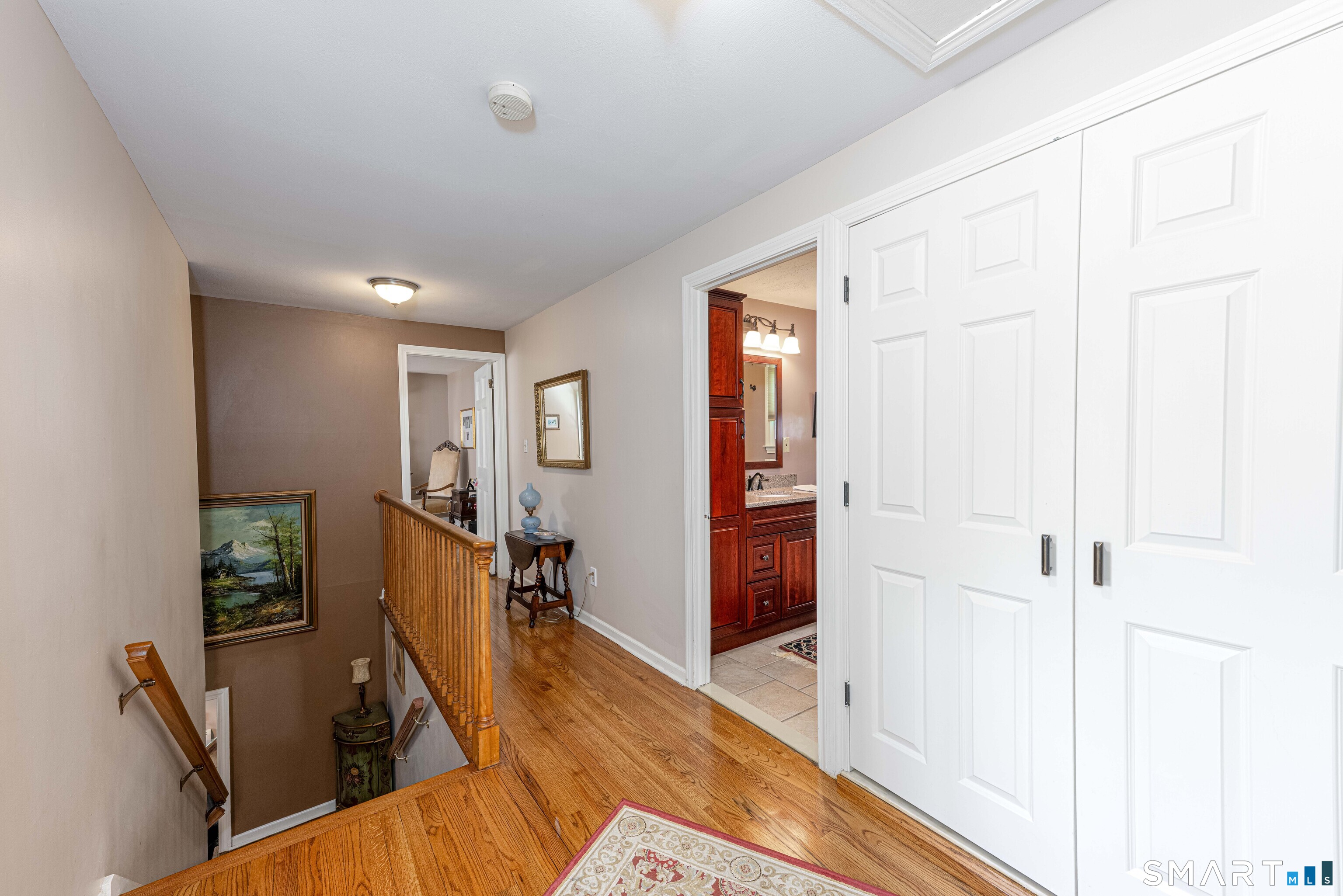 118 Rolling Ridge Road Hamden, CT 06518 - Photo 12 of 21 a view of a hallway with workspace and wooden floor