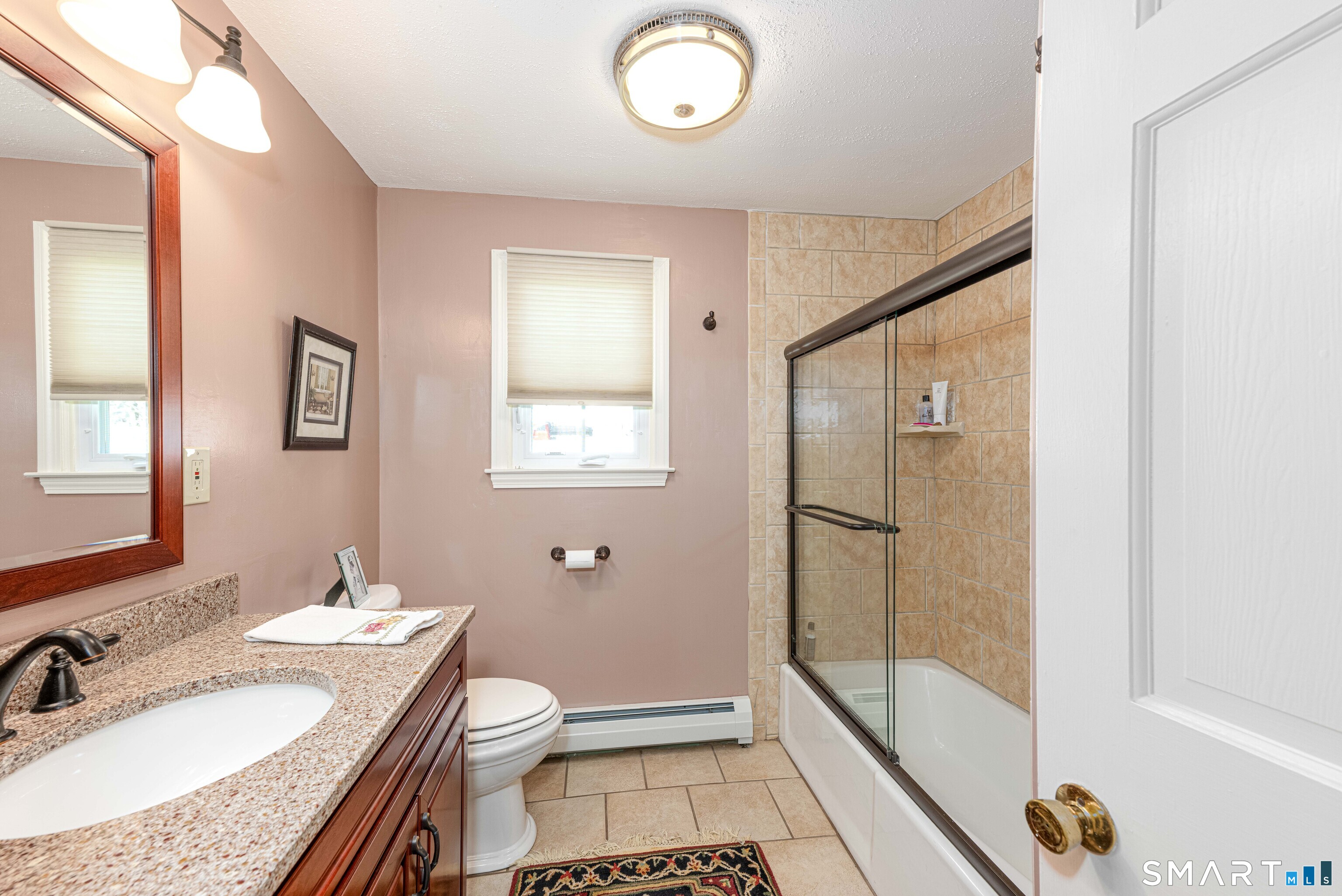 118 Rolling Ridge Road Hamden, CT 06518 - Photo 14 of 21 a bathroom with a granite countertop sink toilet and shower