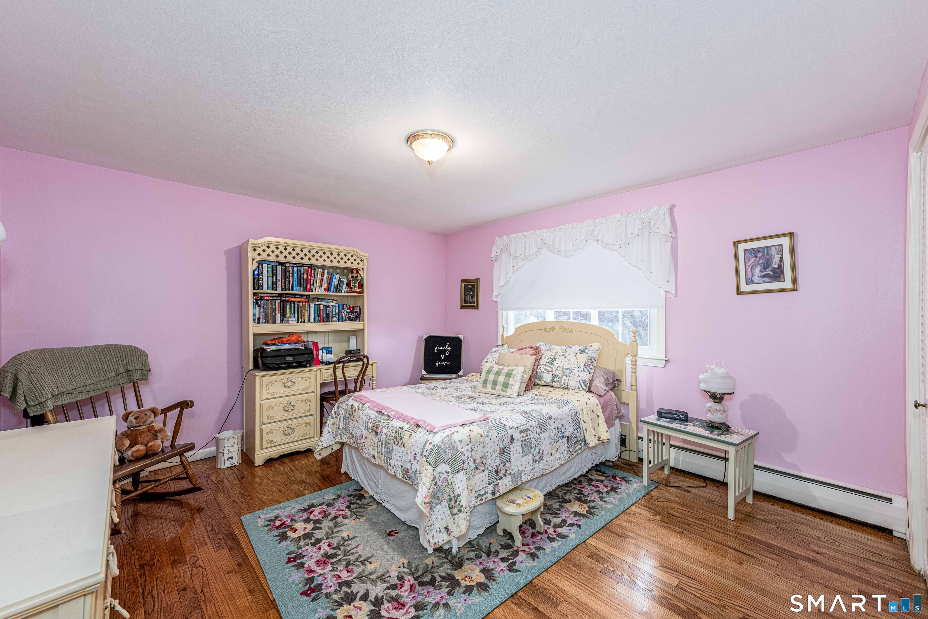 118 Rolling Ridge Road Hamden, CT 06518 - Photo 17 of 21 a bedroom with a bed and wooden floor