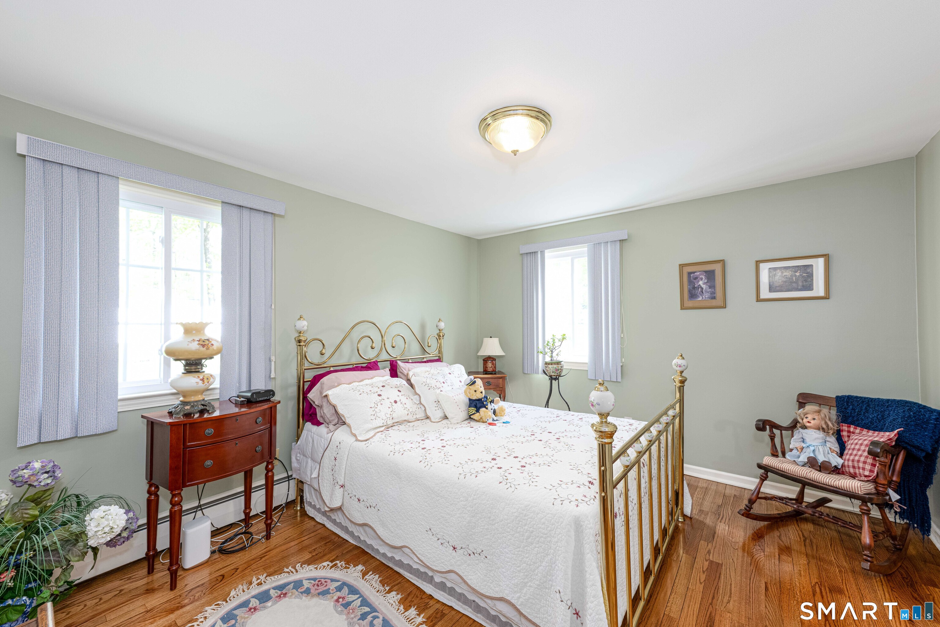 118 Rolling Ridge Road Hamden, CT 06518 - Photo 18 of 21 a bedroom with a bed and wooden floor
