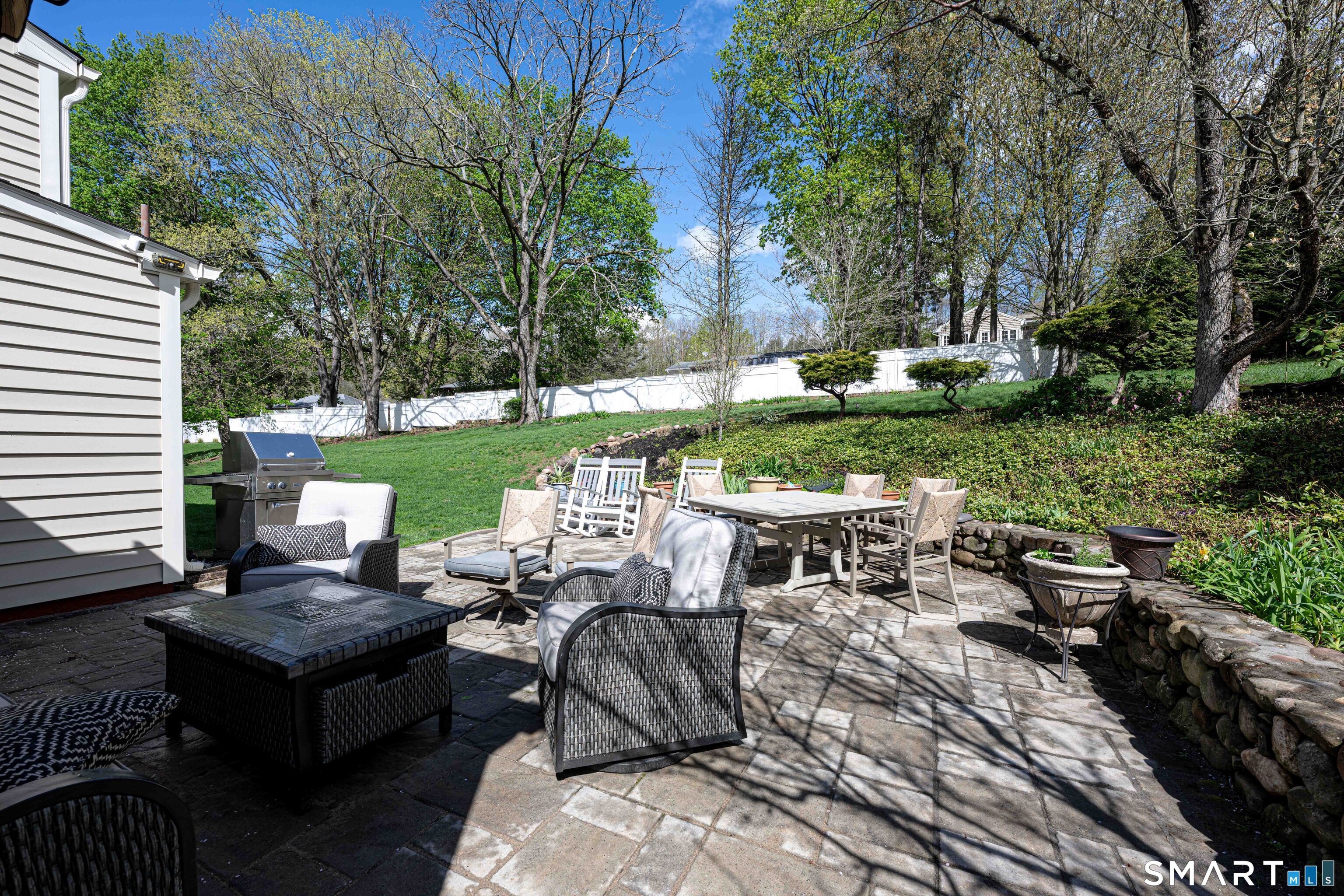 118 Rolling Ridge Road Hamden, CT 06518 - Photo 19 of 21 a view of a patio with couches chairs and a fire pit