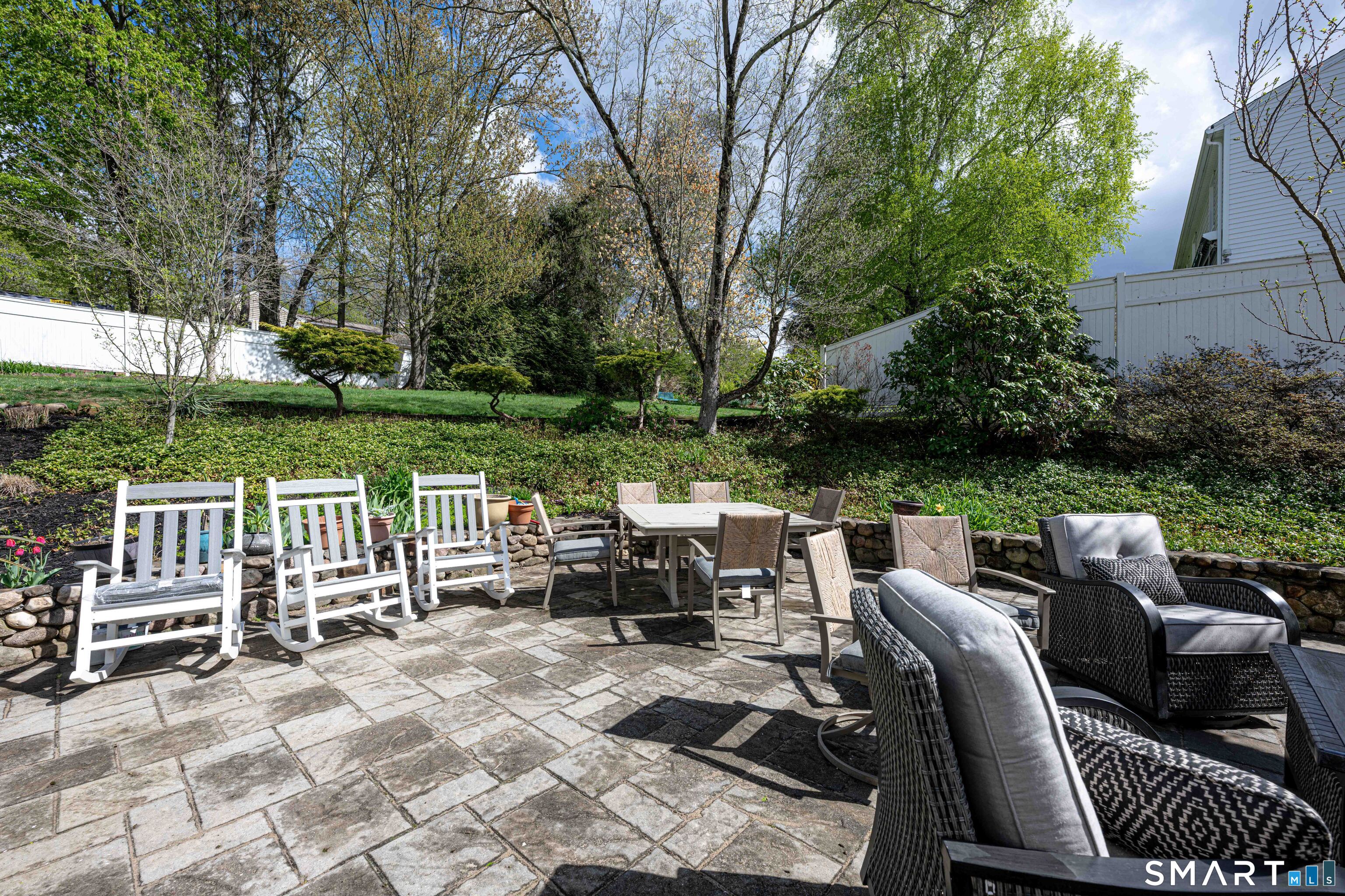 118 Rolling Ridge Road Hamden, CT 06518 - Photo 20 of 21 a view of a patio with chairs and a table