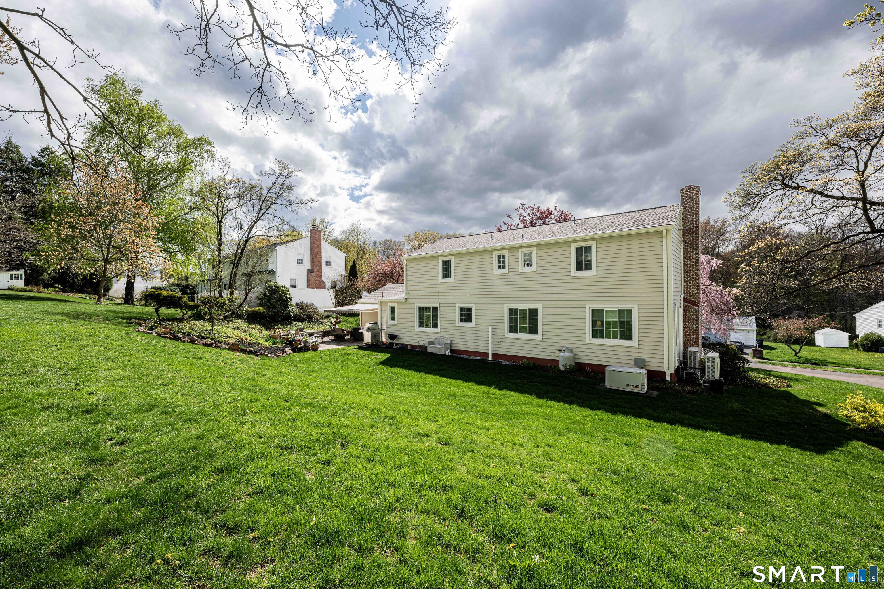 118 Rolling Ridge Road Hamden, CT 06518 - Photo 21 of 21 a view of a house with backyard and sitting area