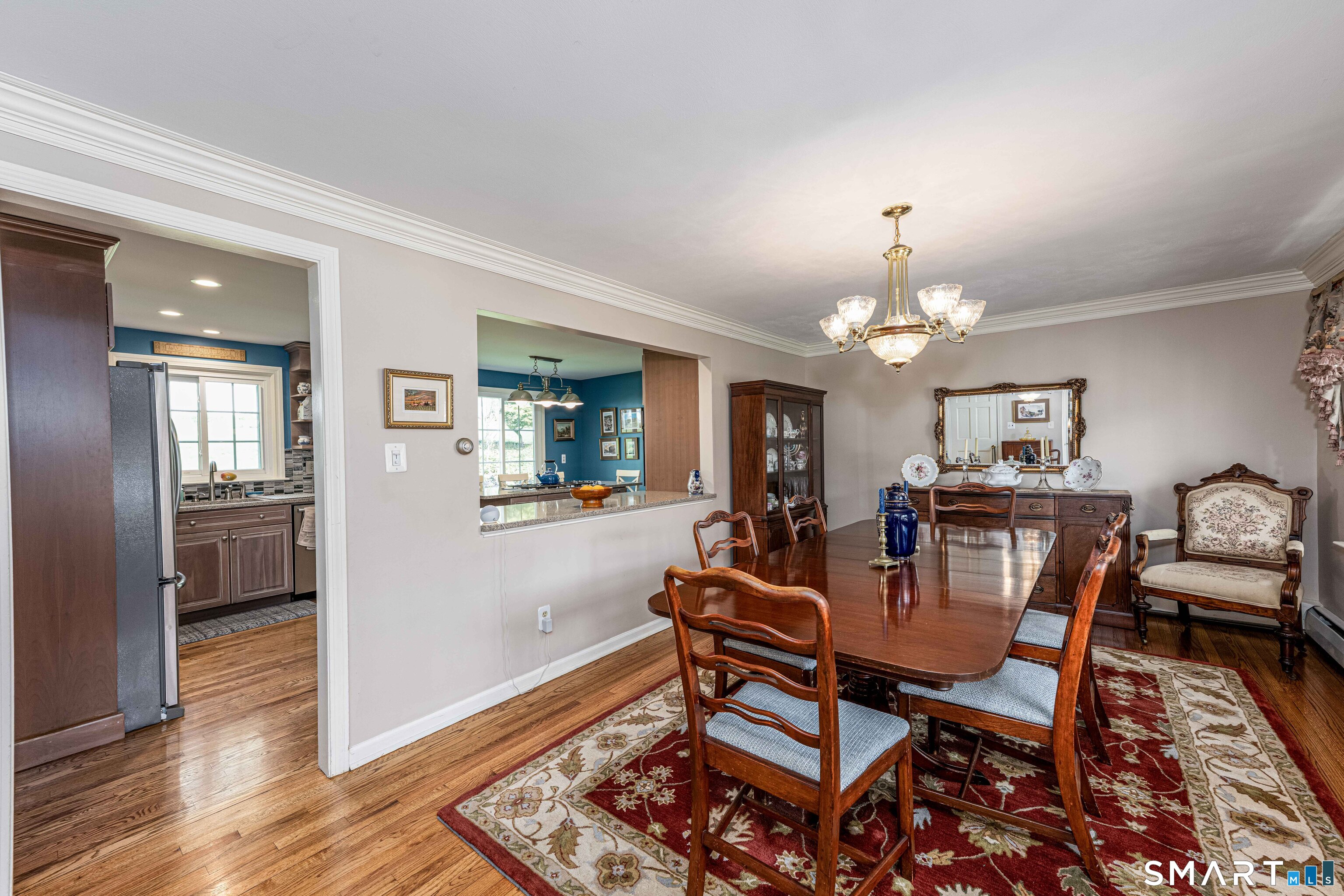 118 Rolling Ridge Road Hamden, CT 06518 - Photo 4 of 21 a view of a dining room with furniture and wooden floor