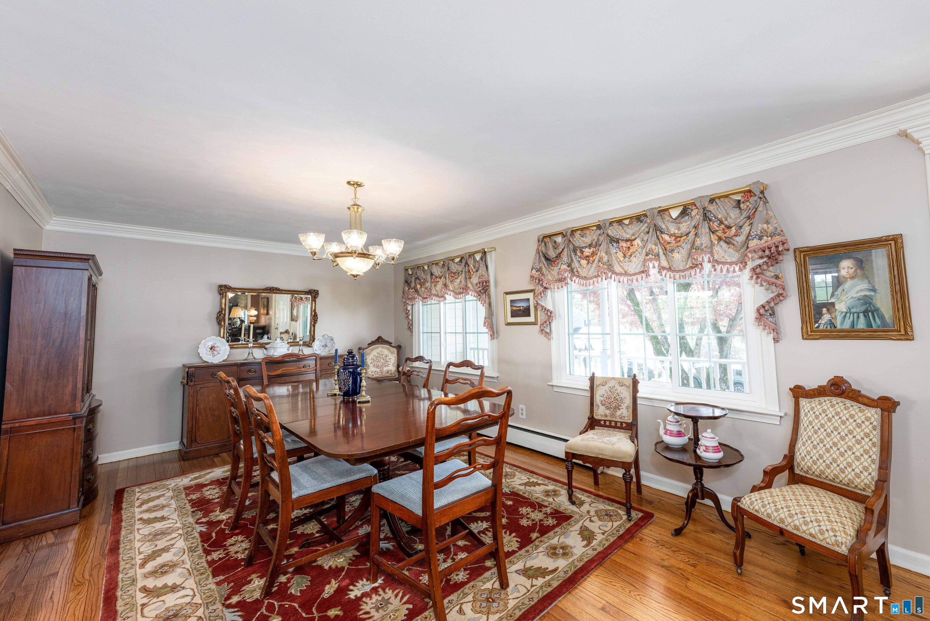 118 Rolling Ridge Road Hamden, CT 06518 - Photo 5 of 21 a view of a dining room with furniture a chandelier and wooden floor