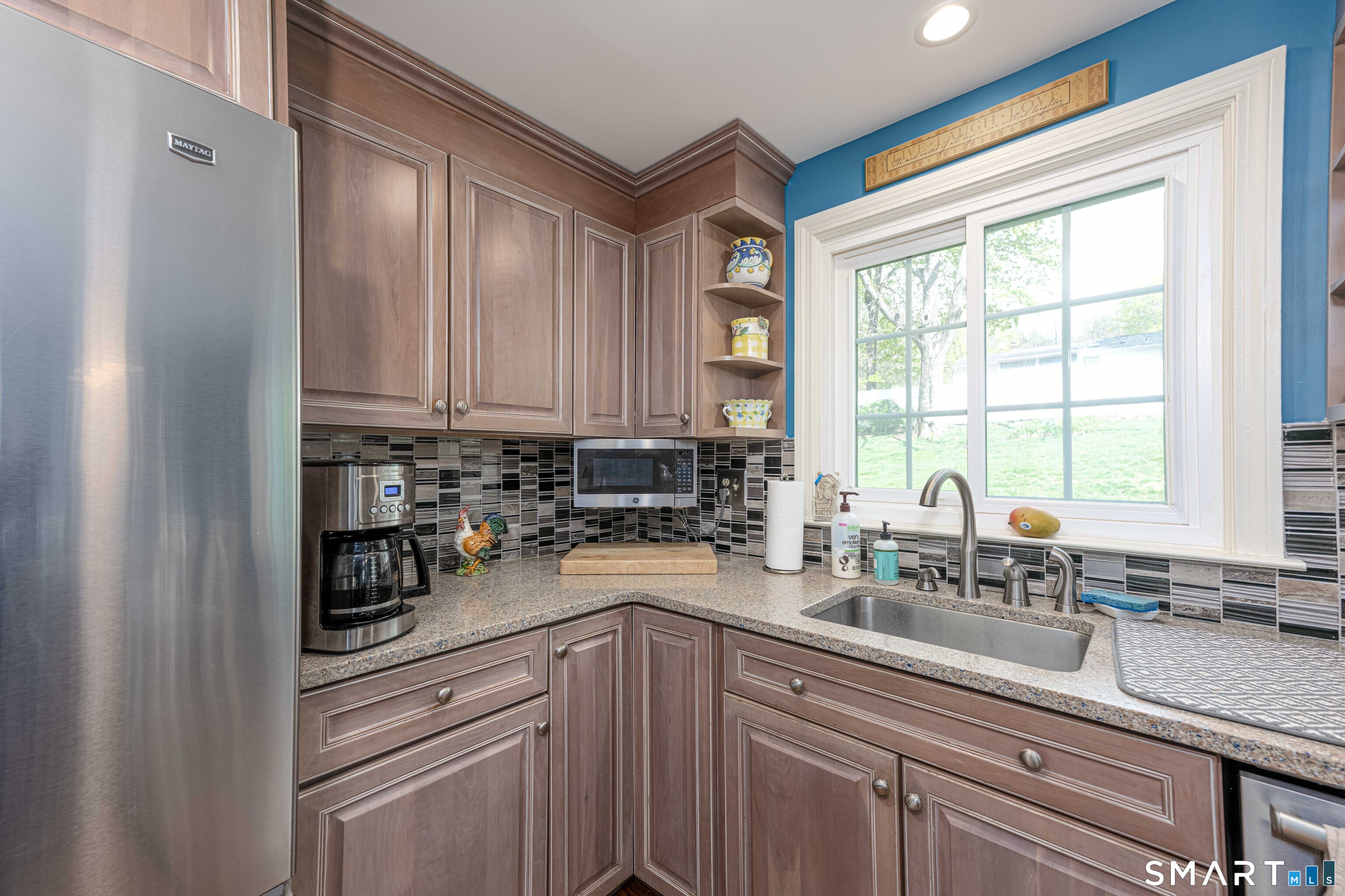 118 Rolling Ridge Road Hamden, CT 06518 - Photo 10 of 21 a kitchen with sink a window and cabinets