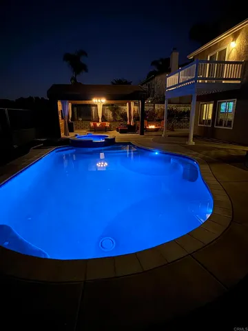 a view of a chairs and table in patio