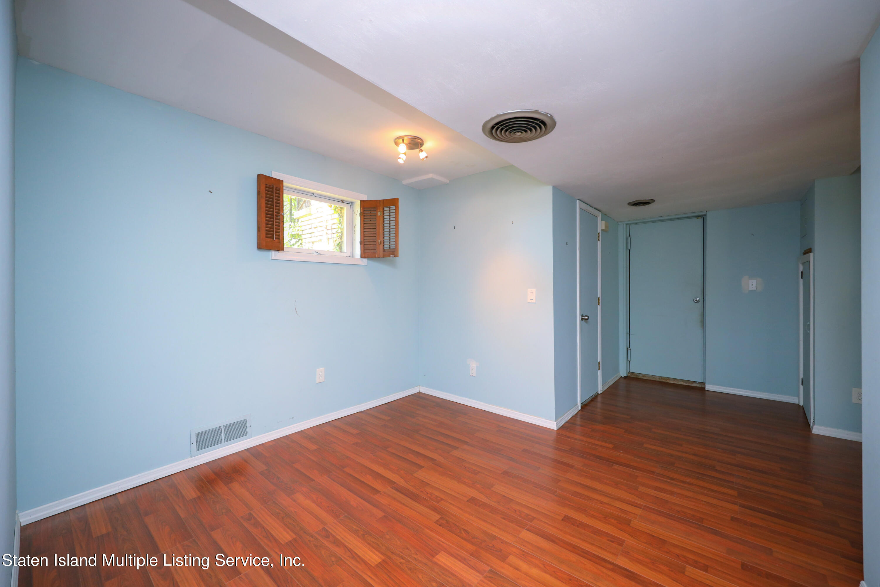 2209 Clove Road Staten Island, NY 10305 - Photo 17 of 38 a view of empty room with wooden floor
