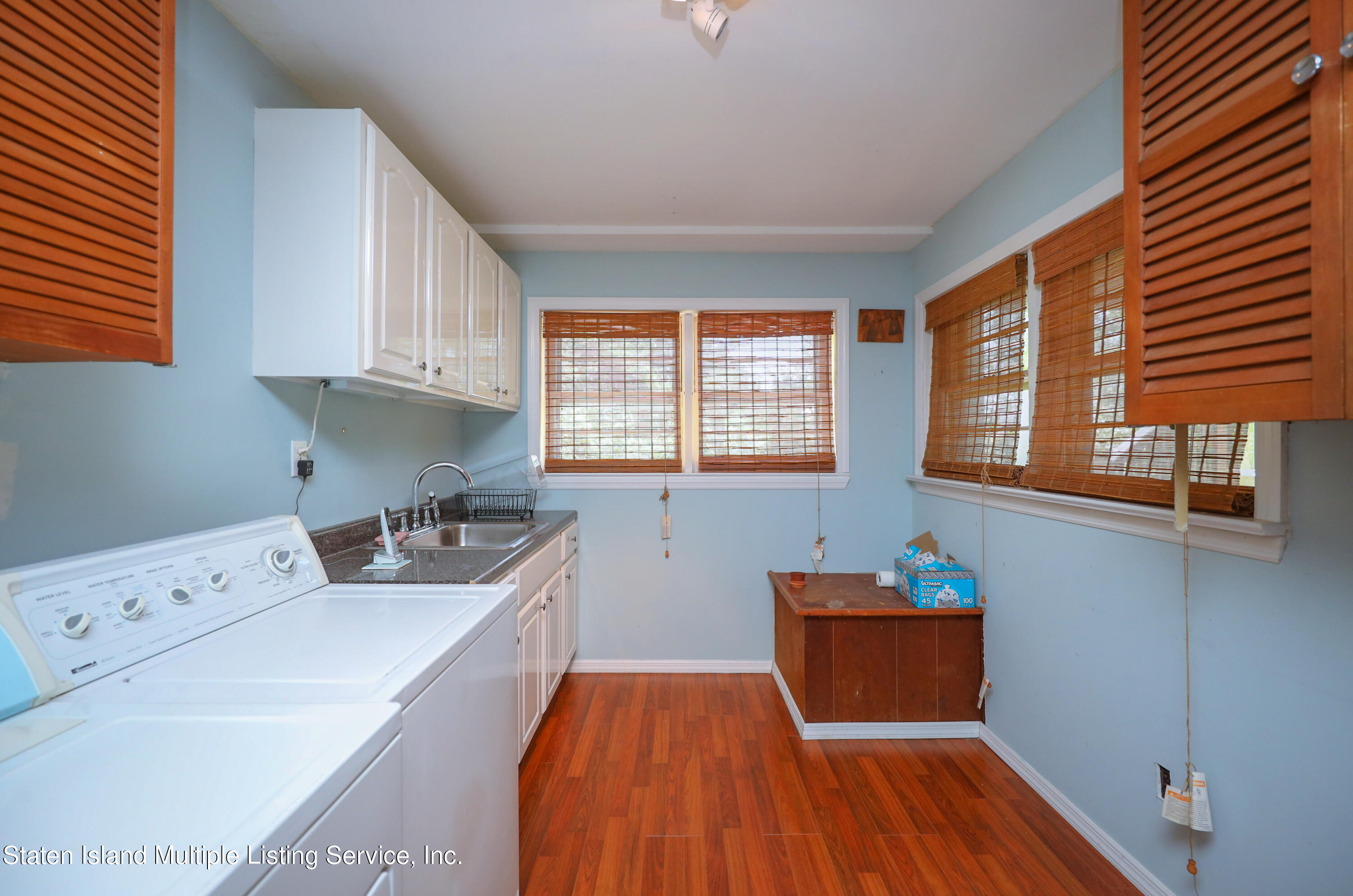 2209 Clove Road Staten Island, NY 10305 - Photo 20 of 38 a room with a bed and wooden floor