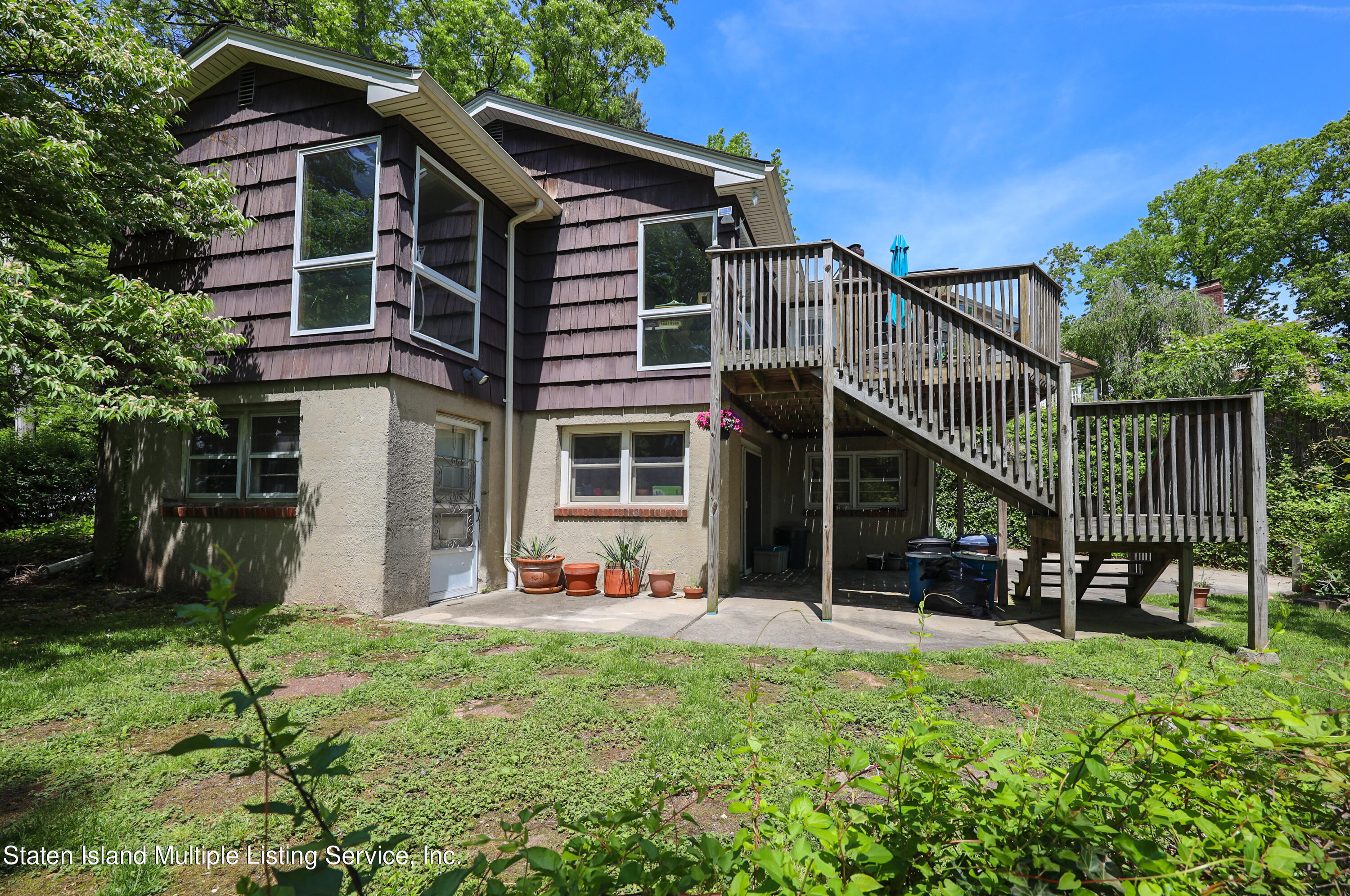 2209 Clove Road Staten Island, NY 10305 - Photo 25 of 38 a view of a house with backyard and porch