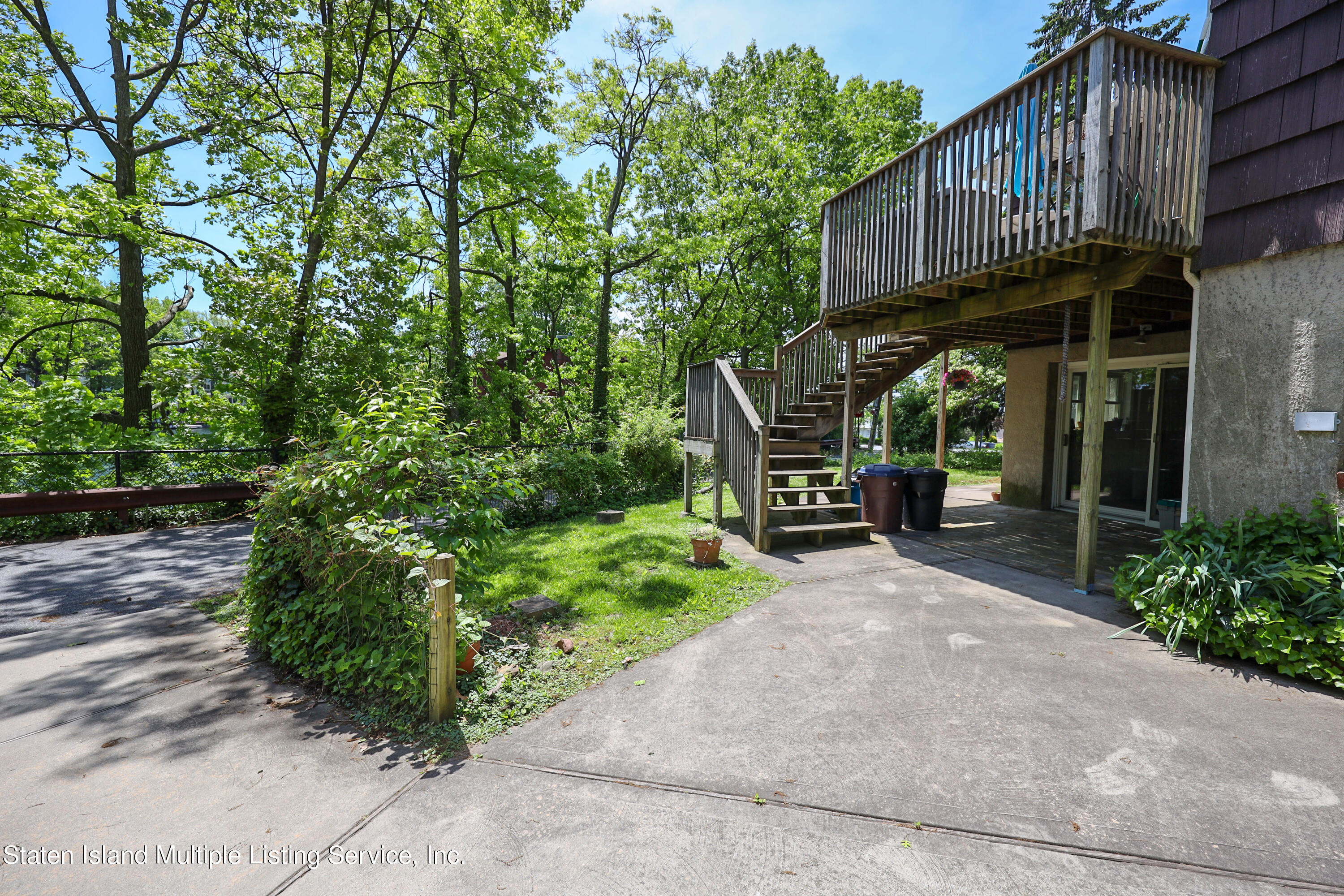 2209 Clove Road Staten Island, NY 10305 - Photo 27 of 38 a front view of a house with garden