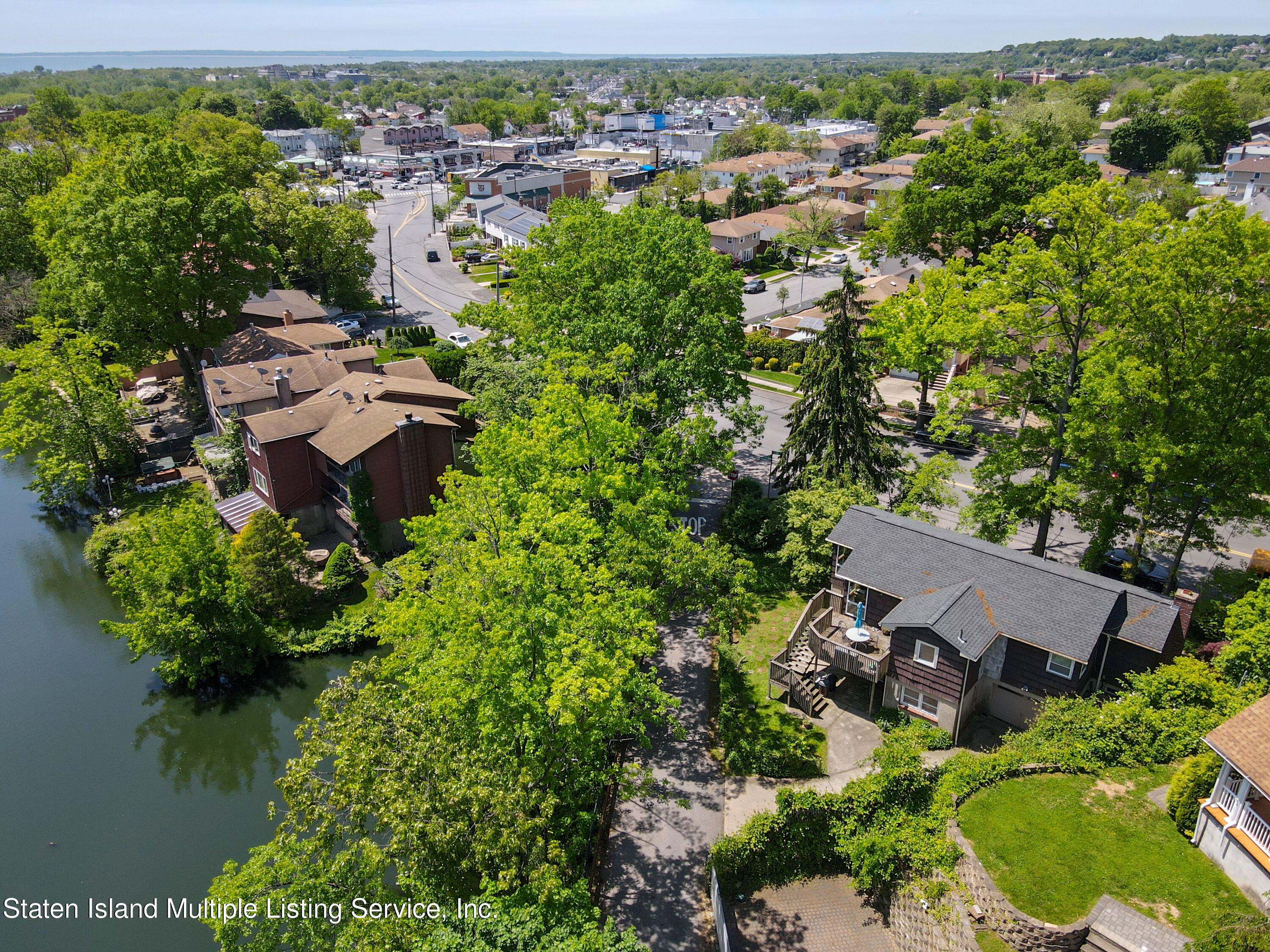 2209 Clove Road Staten Island, NY 10305 - Photo 3 of 38 an aerial view of a house with a yard and lake view