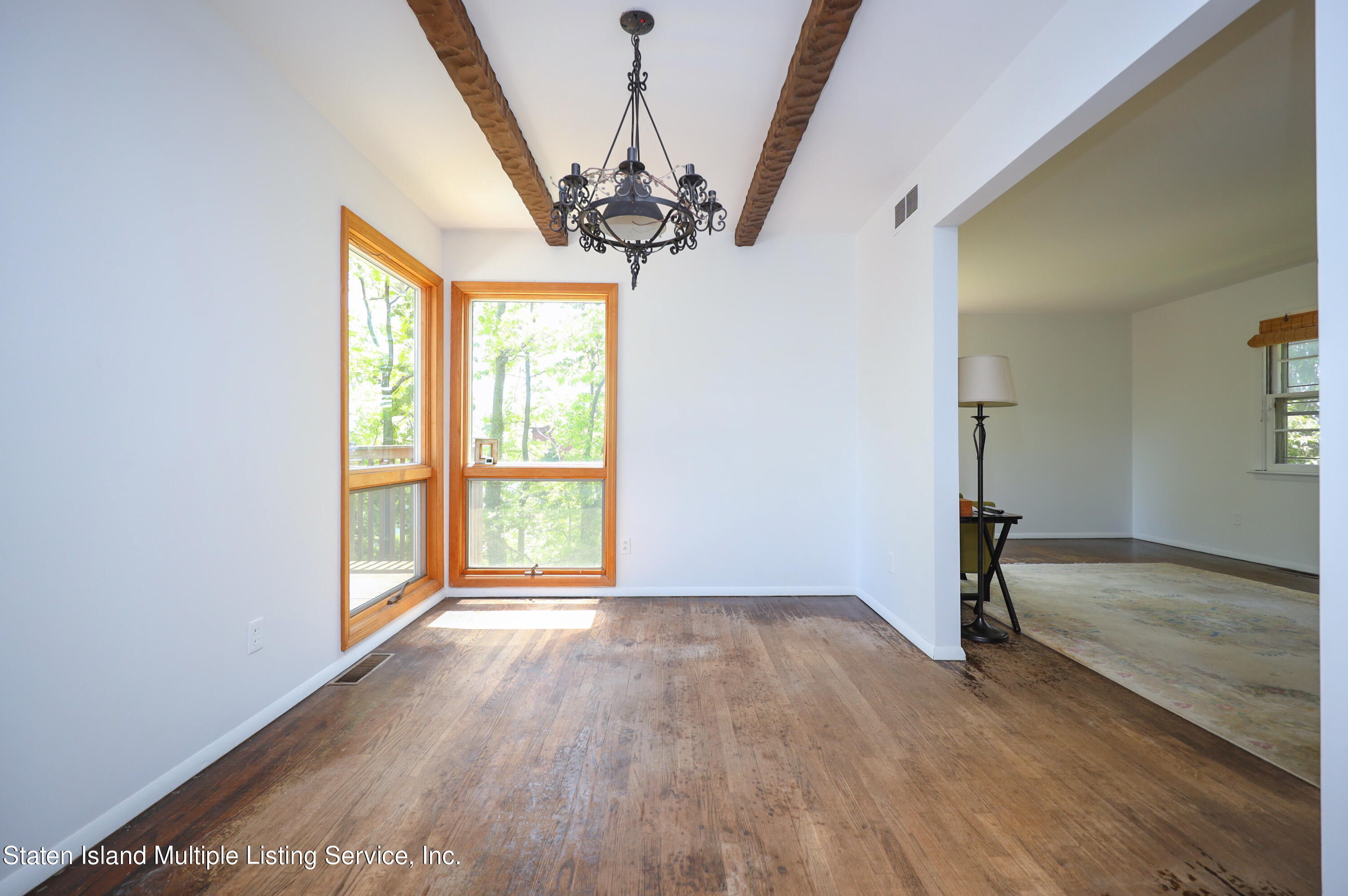 2209 Clove Road Staten Island, NY 10305 - Photo 7 of 38 a view of empty room with wooden floor and fan