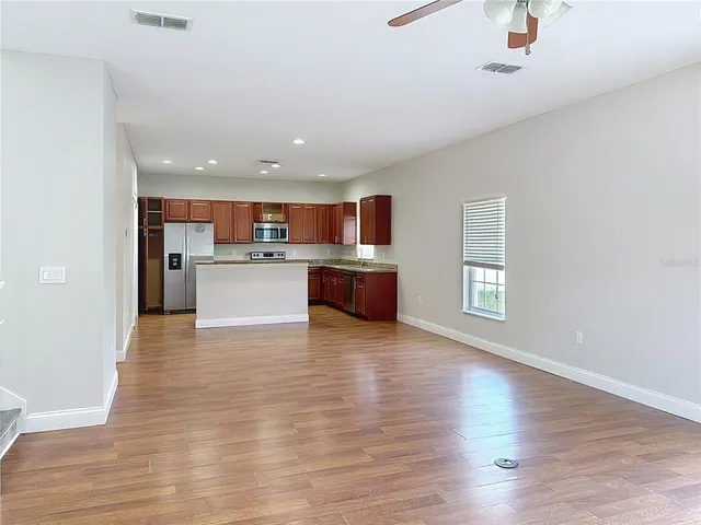 a view of kitchen with wooden floor