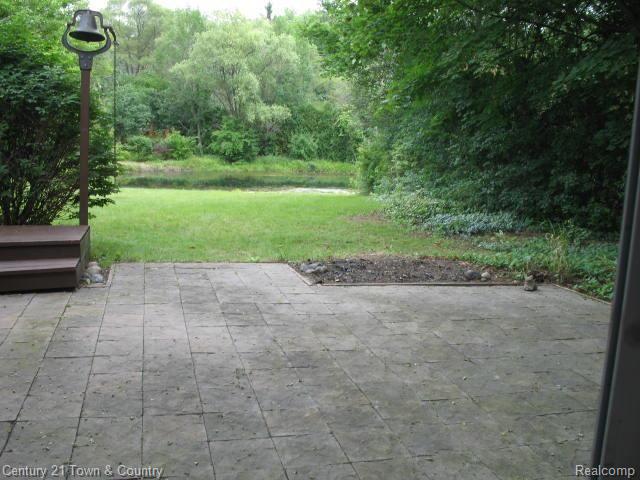 29550 Highmeadow Road Farmington, MI 48334 - Photo 17 of 18 Family Room Patio leading to back yard.jpg