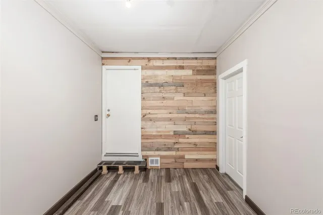 a view of walk in closet with empty racks