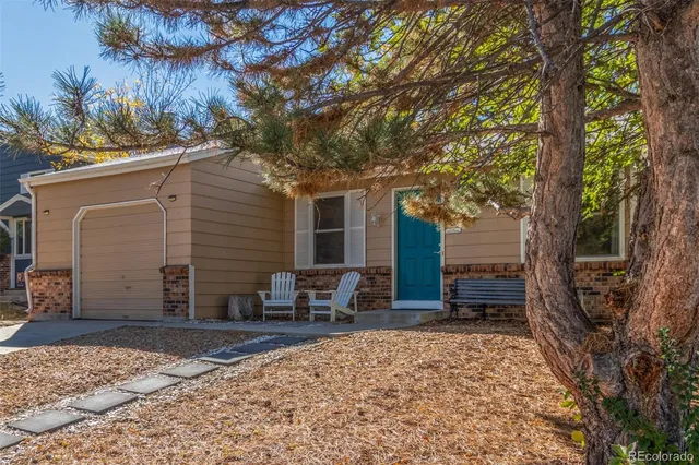 a backyard of a house with seating space