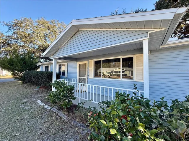 an empty room with a painting on the wall