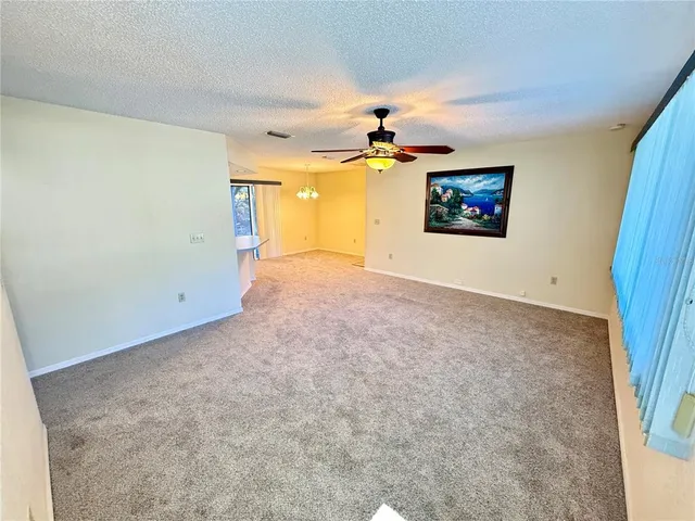 a view of a kitchen with a sink and a window