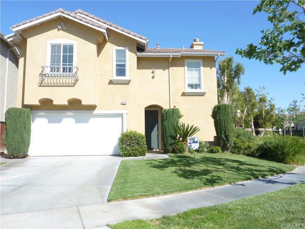 11175 Parkscape Drive Riverside, CA 92505 - Photo 1 of 1 a front view of a house with garden