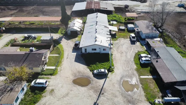 an aerial view of a house with a garden