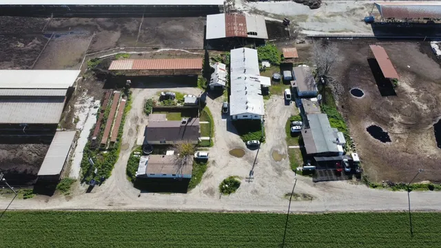 an aerial view of houses with outdoor space
