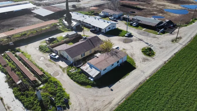 an aerial view of a house with a garden