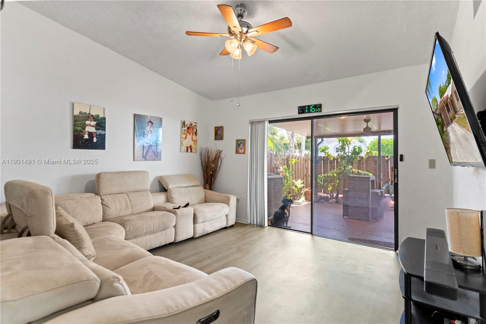 17320 Northwest 66th Place Hialeah, FL 33015 - Photo 11 of 47 a living room with furniture and a large window