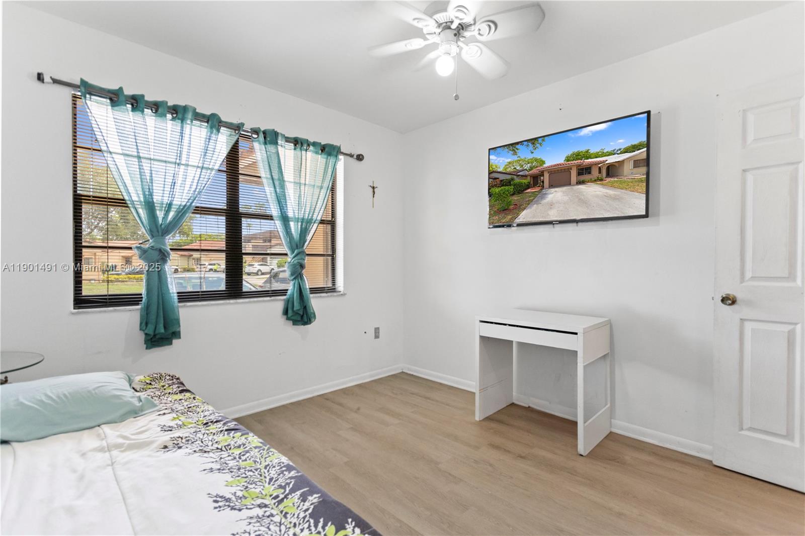 17320 Northwest 66th Place Hialeah, FL 33015 - Photo 25 of 47 a bedroom with a bed and a window