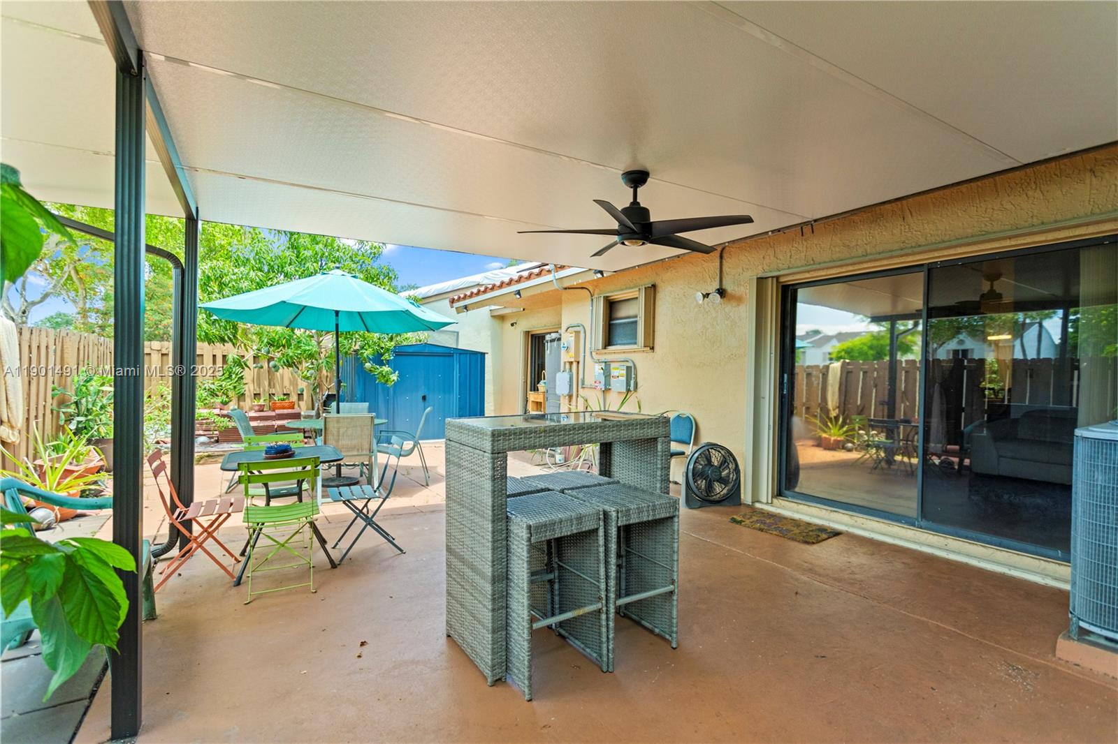 17320 Northwest 66th Place Hialeah, FL 33015 - Photo 33 of 47 a view of a chairs and table in a patio