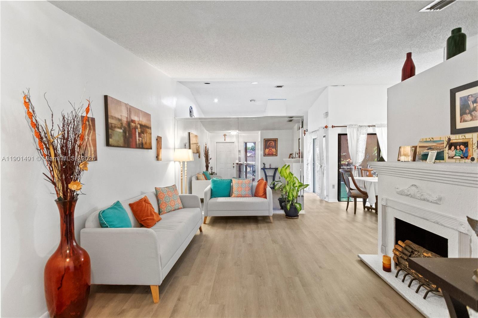 17320 Northwest 66th Place Hialeah, FL 33015 - Photo 6 of 47 a living room with furniture and a fireplace