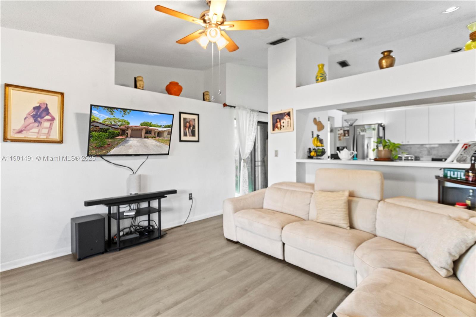 17320 Northwest 66th Place Hialeah, FL 33015 - Photo 9 of 47 a living room with furniture and a chandelier