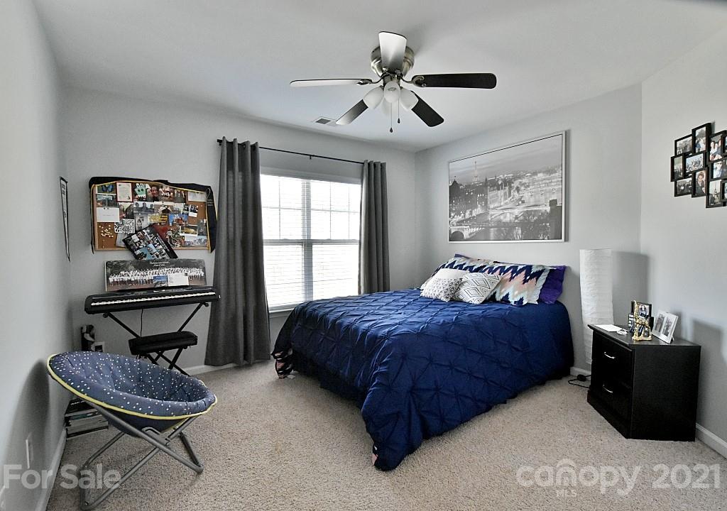 265 Sand Paver Way Fort Mill, SC 29708 - Photo 22 of 29 a bedroom with a bed dresser and window