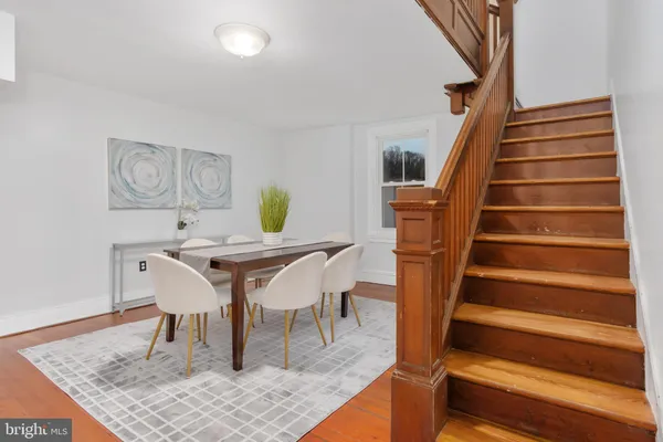 a stove top oven sitting inside of a kitchen and white cabinets