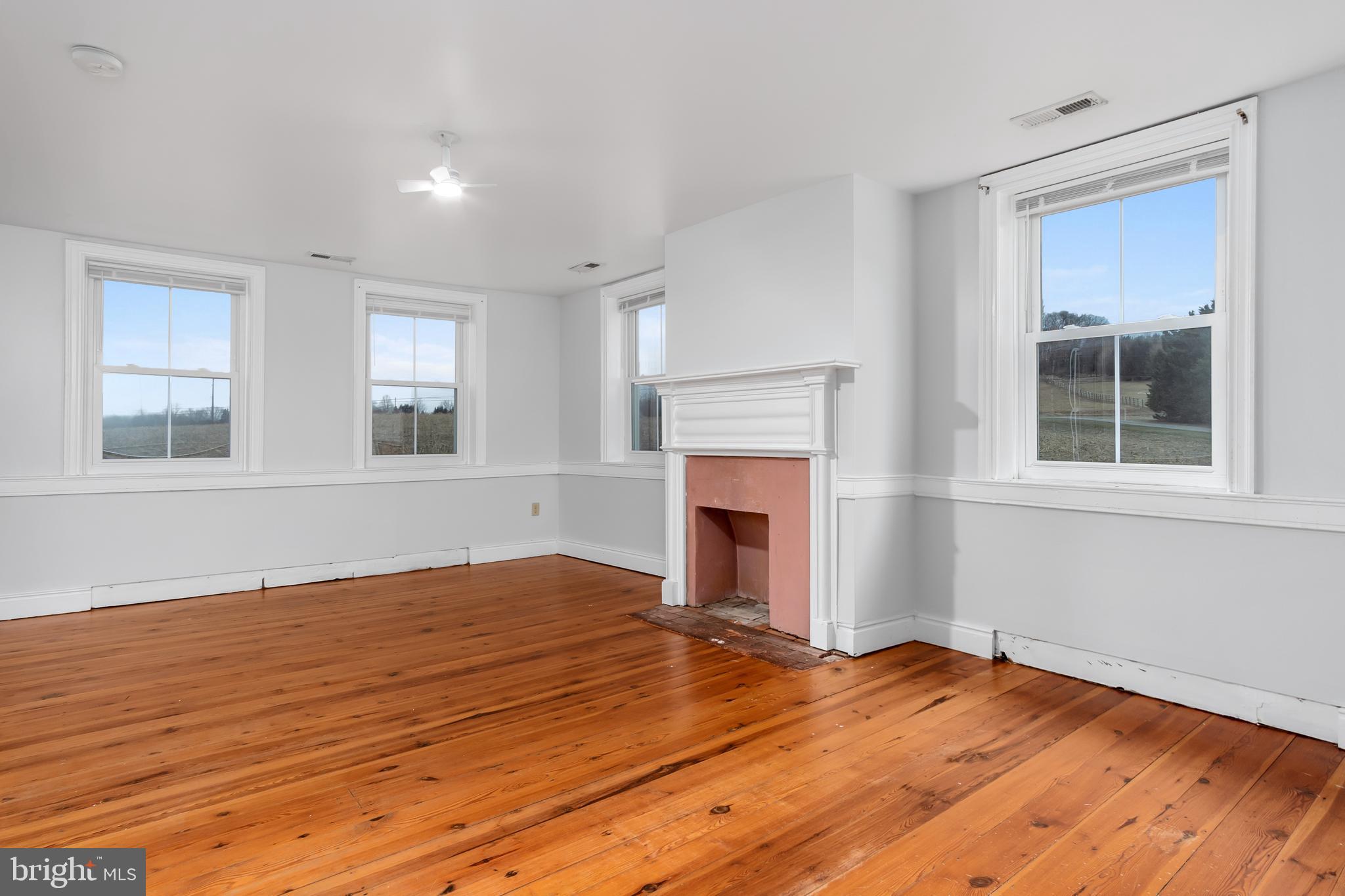 2730 Marker Road Middletown, MD 21769 - Photo 27 of 73 a view of empty room with wooden floor and fireplace