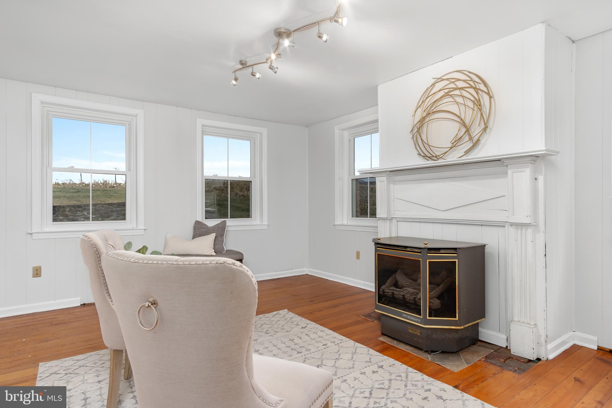 2730 Marker Road Middletown, MD 21769 - Photo 9 of 73 a living room with furniture a window and a fireplace
